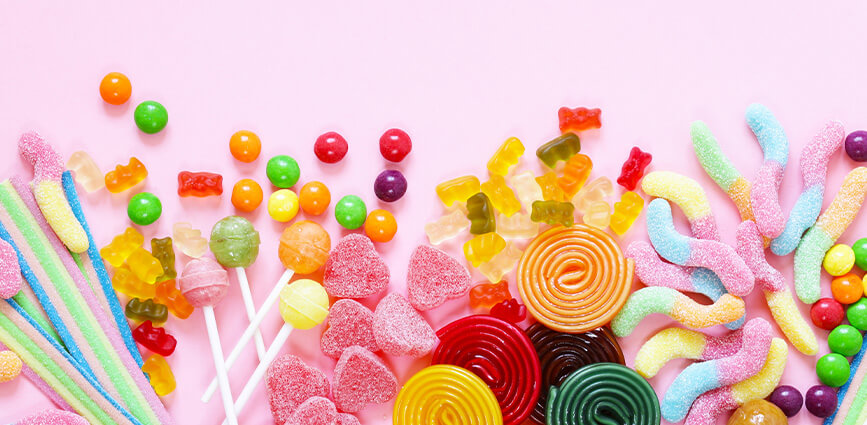 Various sugar-free candy including lollipops, sour candy, and hard candy