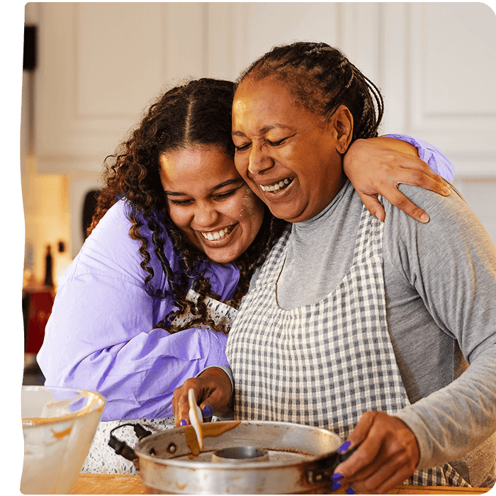 Girl and her grandmother hugging. Pyure is a great sugar substitute for any sweet recipe.