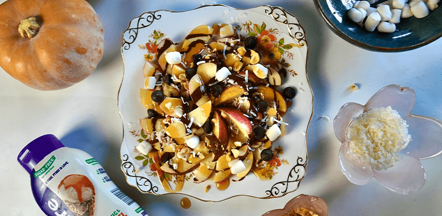 Apple Nachos with Hazelnut & Caramel Drizzle on plate with Pyure caramel syrup