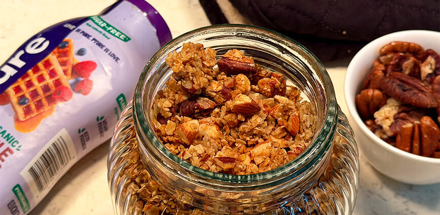 Homemade sugar-free maple granola made with Pyure maple syrup in a glass jar