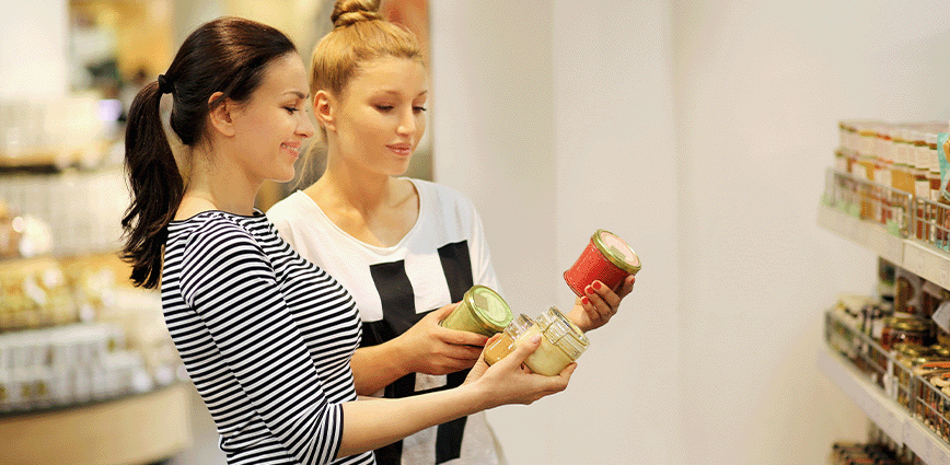 women reading nutritional labels