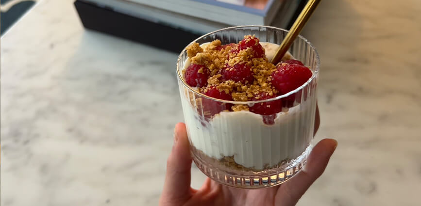 High-Protein Raspberry Cheesecake Cups in Glass with spoon