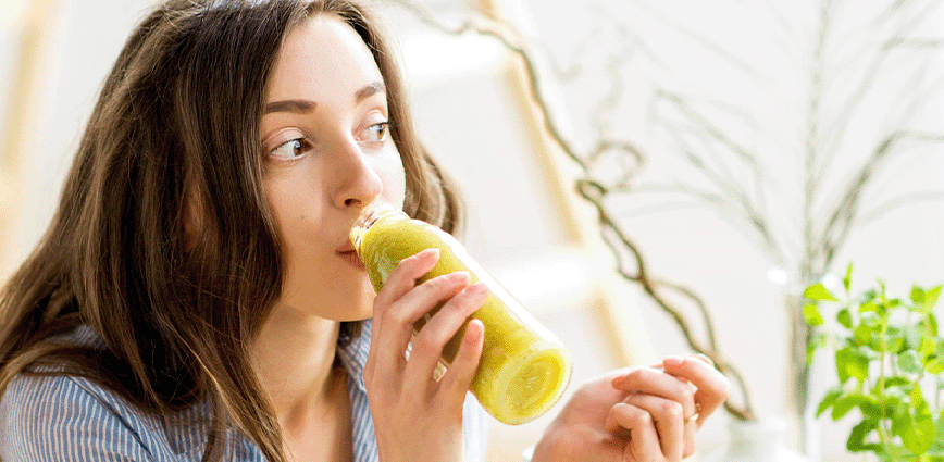 Woman drinking juice. Simply add Pyure Stevia Recipes 