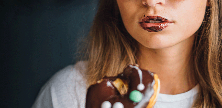 girl eating donut without sugar alternatives