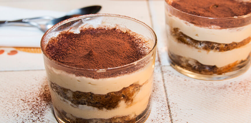 Easy Vegan Tiramisu (Low-Sugar, No-Bake Dessert) shown layered in glasses