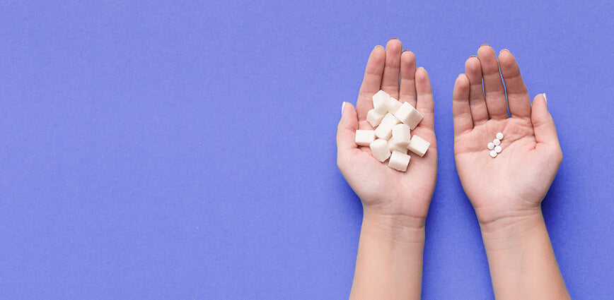 Human hands comparing different Artificial Sweeteners