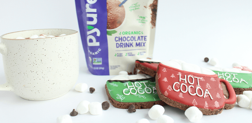 Low Sugar Hot Cocoa Cookies with marshmallows and bag of Pyure Chocolate Drink Mix