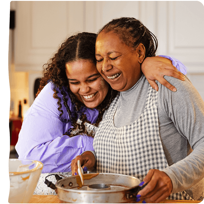 Girl and her grandmother hugging. Pyure is a great sugar substitute for any sweet recipe.  